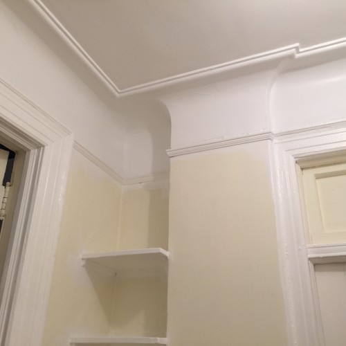 Trim and plaster cove in Benjamin Moore Chantilly Lace White. 