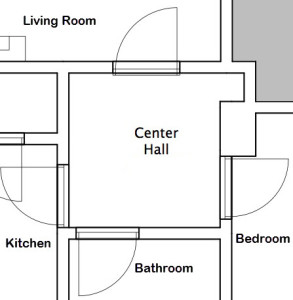 This is our Center Hall and it connects with the Living Room, Bedroom, Bathroom, and Kitchen. It also features a nice little niche with some shelves.