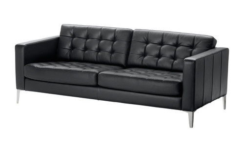 Ikea Karlstad sofa in black leather with aluminum legs. Simple, timeless, classic..... Except for those aluminum legs. 
