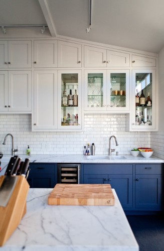 We both love this kitchen.... Especially the blue lower cabinets. I also think it is fabulous that they took the time to design the upper row to fit within the angle of the ceiling.