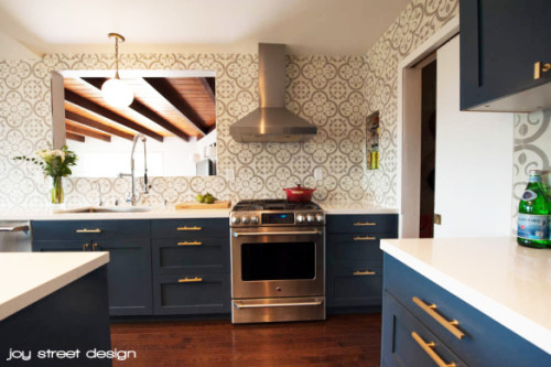 There is a lot to love about this Boston kitchen featuring Ikea cabinet shells with painted DIY Shaker Semihandmade Doors. Of course the marble counter tops, brass hardware and dark blue cabinets are hitting all the right notes for me.