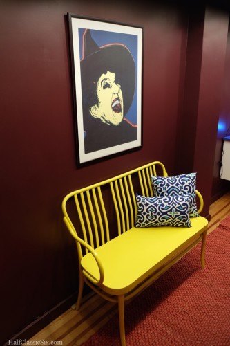 Andy Warhol's Wicked Witch has taken up company over our yellow bench which we purchased before we closed on the property.