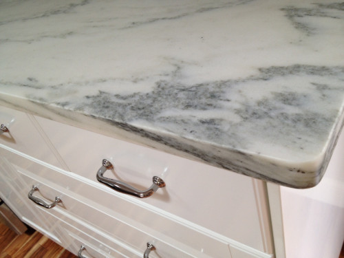 Honed marble is a risky choice according to some, but we are willing to accept the inherent risks of possible pitting, etching, and staining because, well, because that is what marble does. [Source: The Garden Web] 