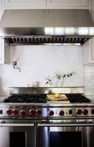 Although admittedly risky as far as keeping spills and stains away, adding a marble slab behind the stove is absolutely stunning. [Source: Remodelista] 