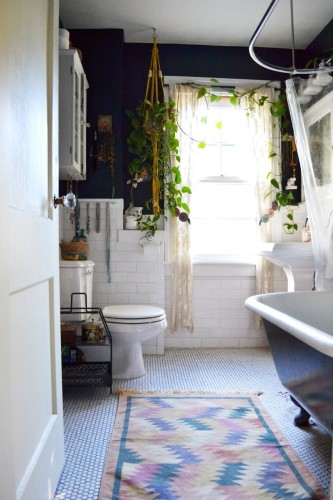 This bathroom, while not quite like ours, is none the less an inspiration for ours. Essentially, I plan to play up our existing black and white tile scheme and make it work. [Source: Apartment Therapy]