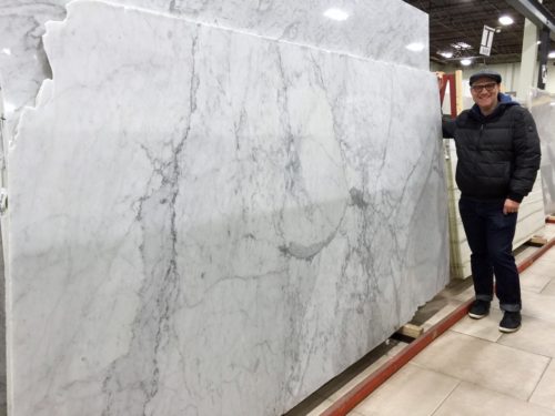 My handsome husband guarding the only slab of honed Carrara marble to be found in eastern New Jersey.