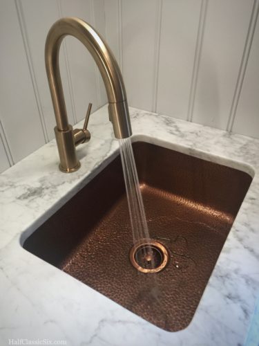 Running water for the first time in 130 days! Such a good feeling. [<i>Source: Faucet - <a href=“http://www.homedepot.com/p/Delta-Trinsic-Single-Handle-Pull-Down-Sprayer-Kitchen-Faucet-in-Champagne-Bronze-Featuring-MagnaTite-Docking-9159-CZ-DST/203155724” target=“blank”>Delta Trinsic Series</a>, Sink from <a href="http://www.sinkology.com/kitchen-sink/renoir-undermount-copper-kitchen-sink/" target="blank">Sinkology</a> </i>]