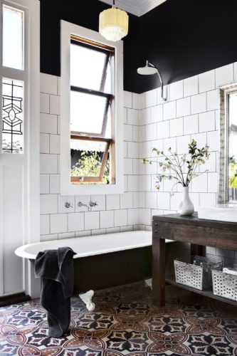 I stumbled across this Australian bathroom and was immediately grabbed by the black upper walls with white tile lower walls. [Source: Homes to Love (AU)] 